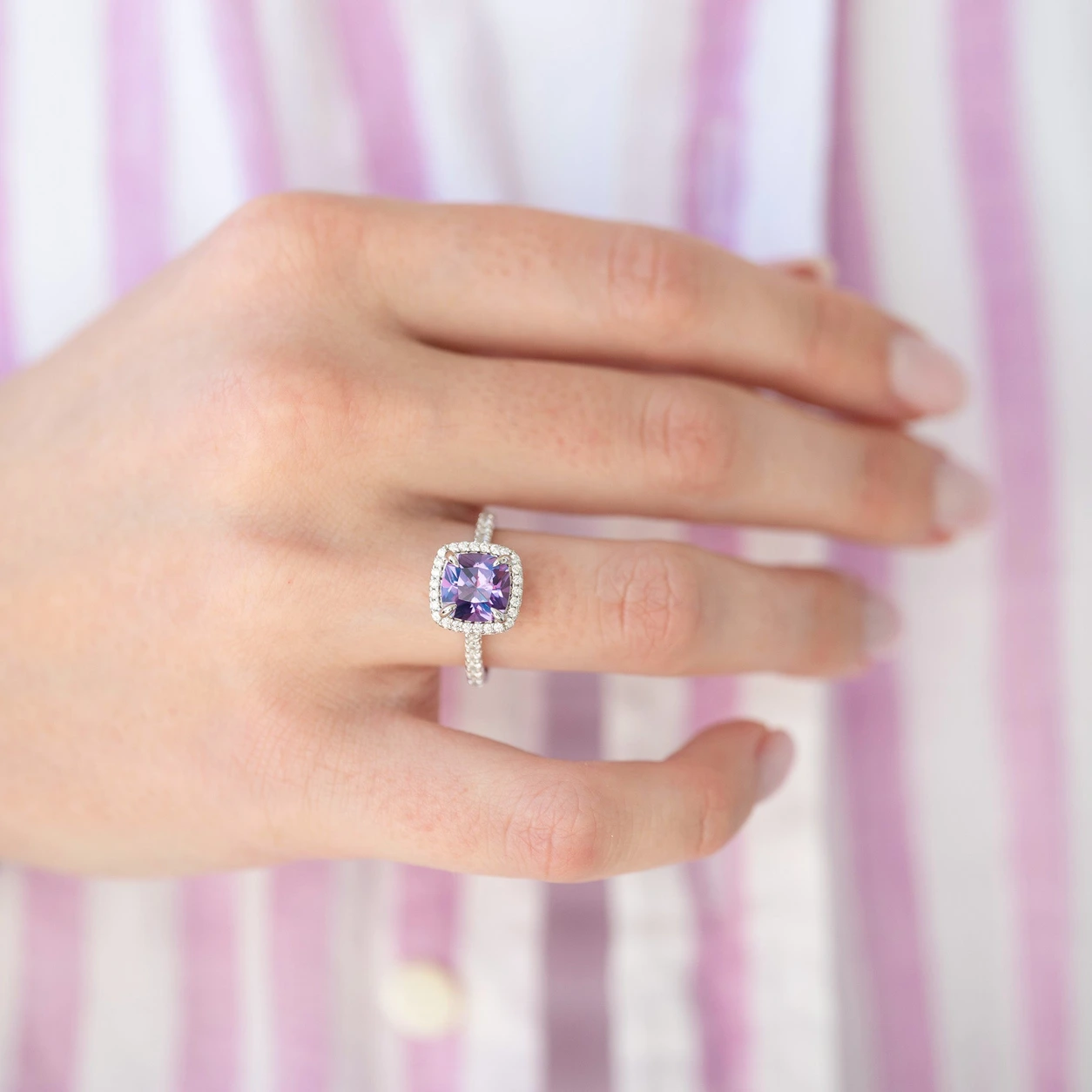 Belle alexandrite cushion ring — authentic hand view