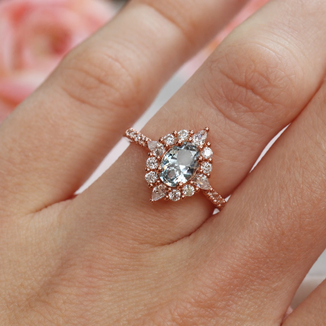 Astra aquamarine ring in rose gold vermeil, close-up worn on hand